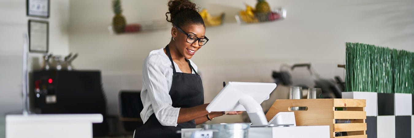 Woman using tablet for a transaction