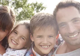 Happy family smiling for a picture